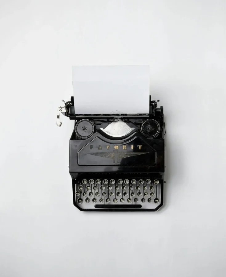 Copywrite typewriter with a paper attached.